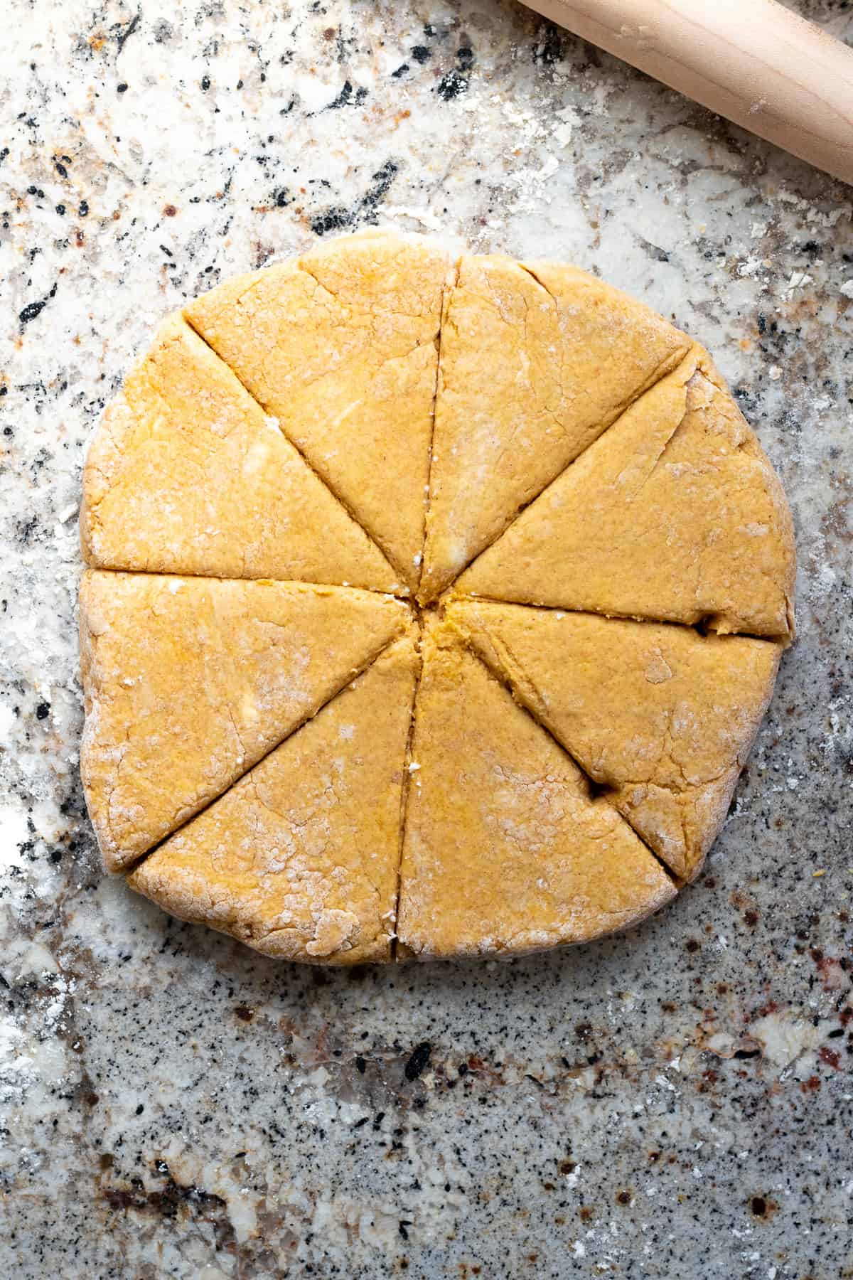 scone dough patted into a round and cut into 8 wedges