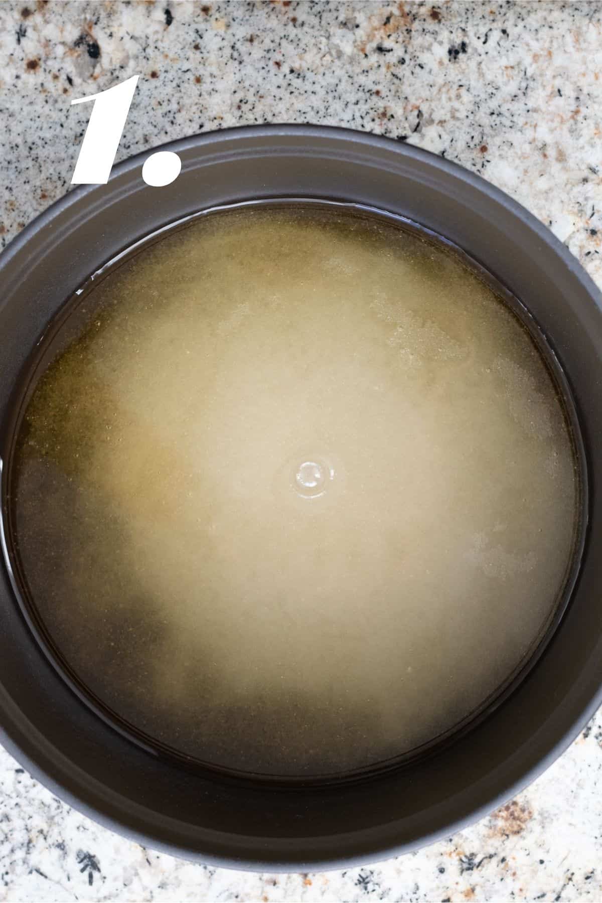 Agave, cane sugar and water mixed together in large heavy pot.
