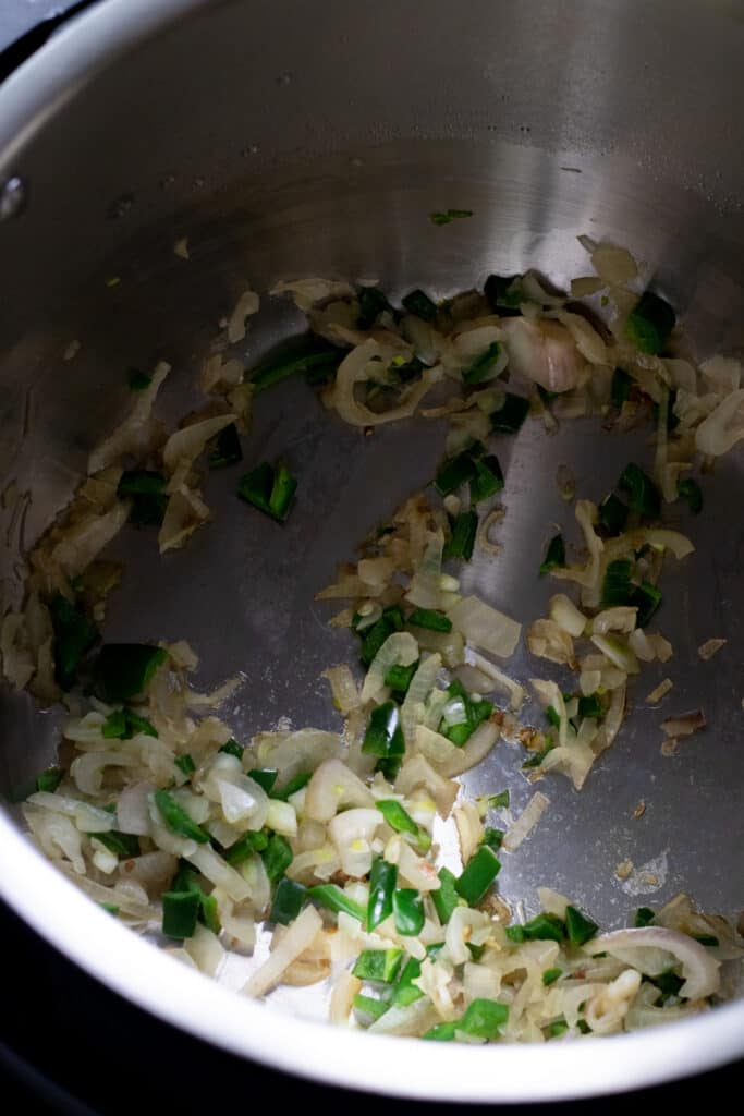 Sauteed jalapenos and shallot in the Instant Pot.