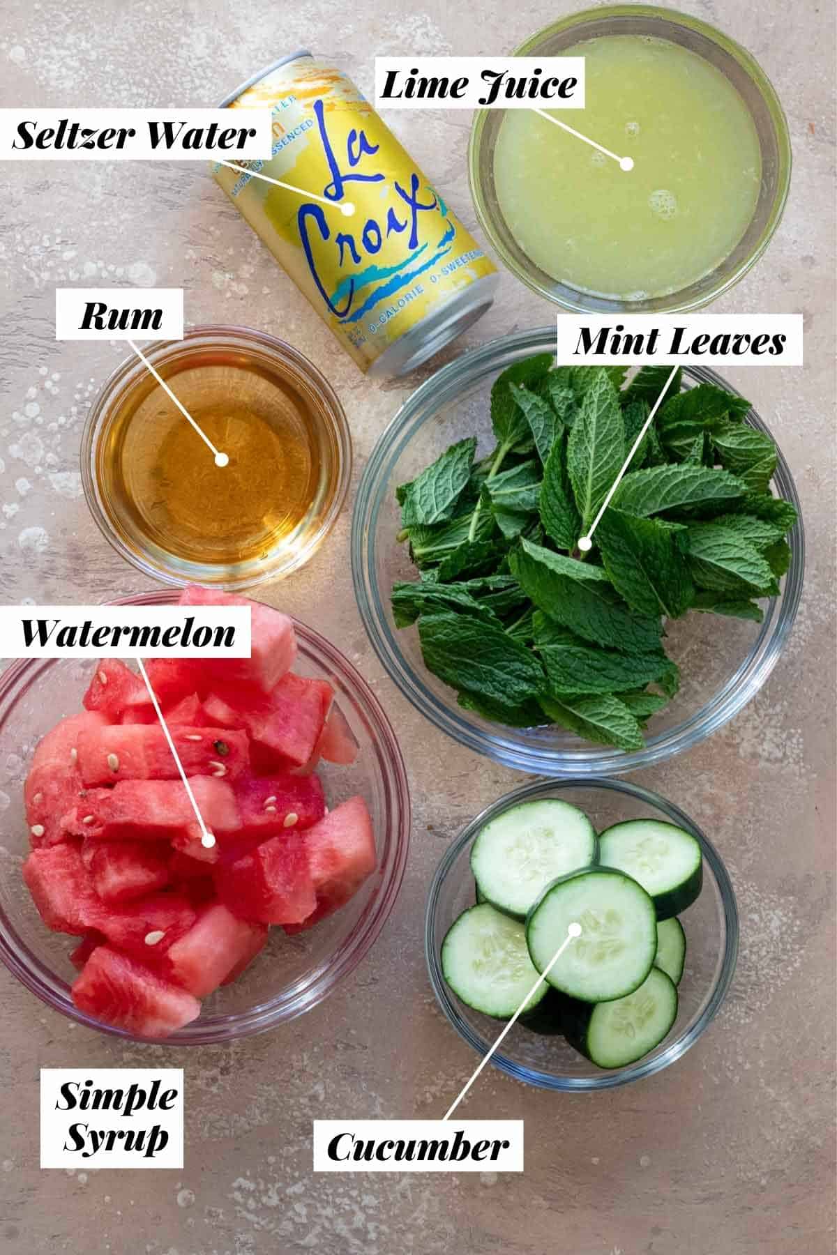 Ingredients needed to make mojito measured out into individual glass bowls and labeled. 