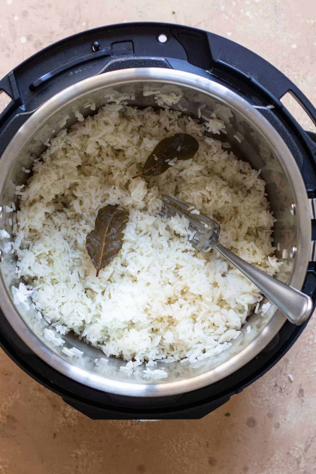 Cooked rice after fluffing it with a fork.