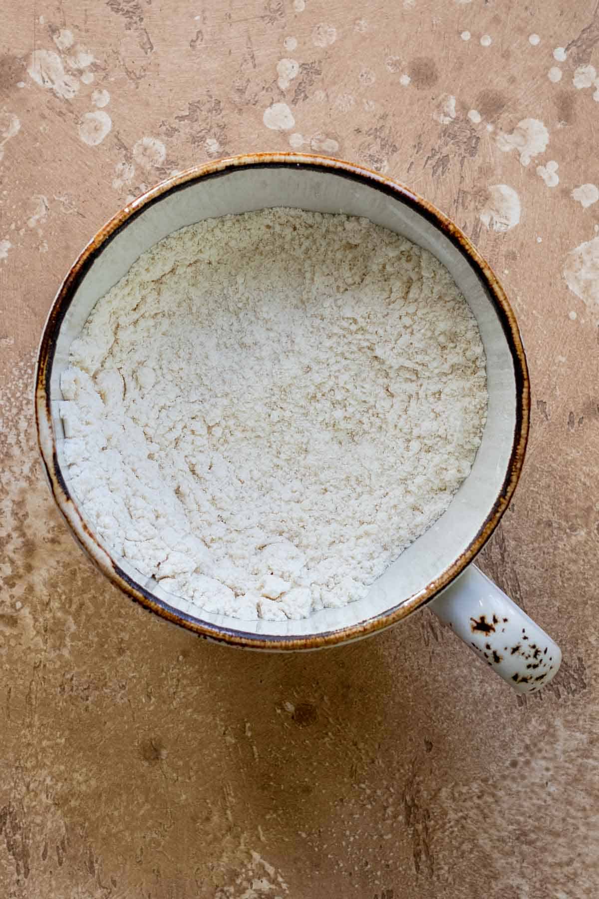 Dry ingredients mixed together in mug.