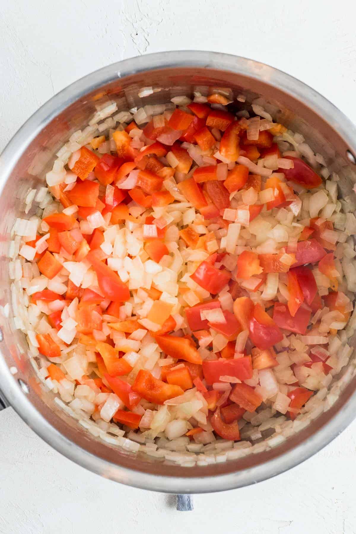 Diced onion and bell pepper sautéed in Instant Pot.