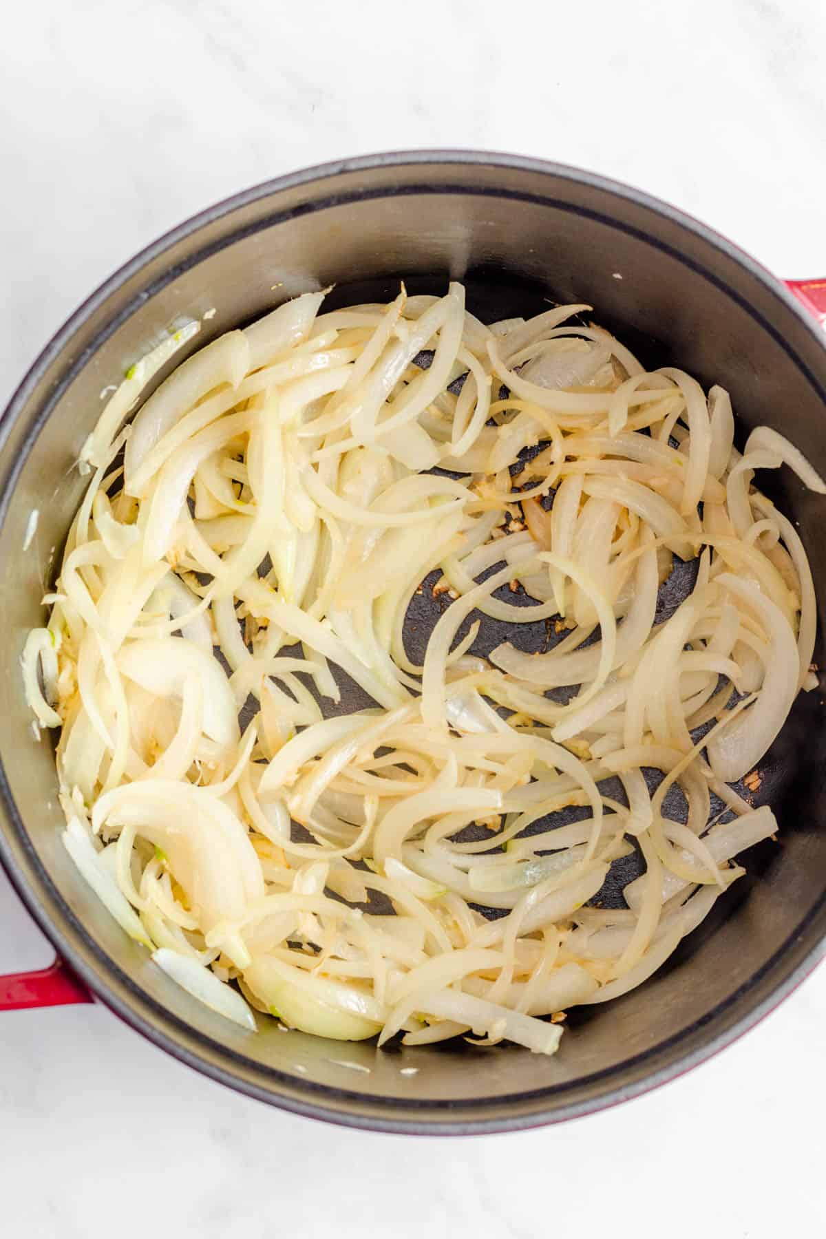 Onions and garlic sauteed together in pot.