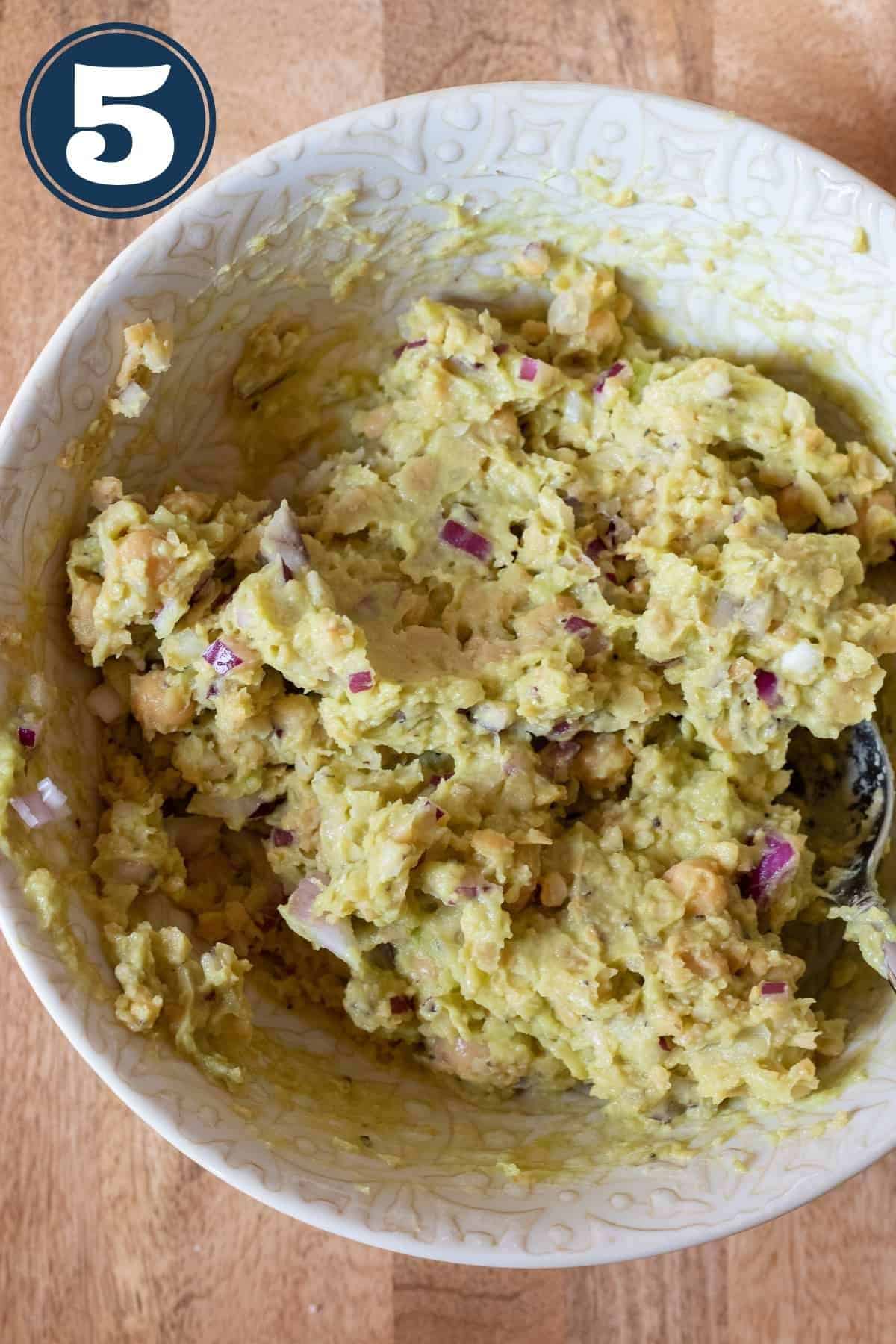 Mashed avocado mixed with mashed chickpeas.