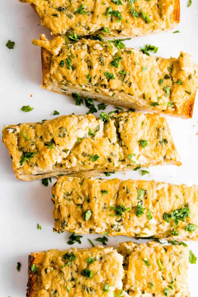 Cheesy vegan garlic bread after baking and cut into slices.