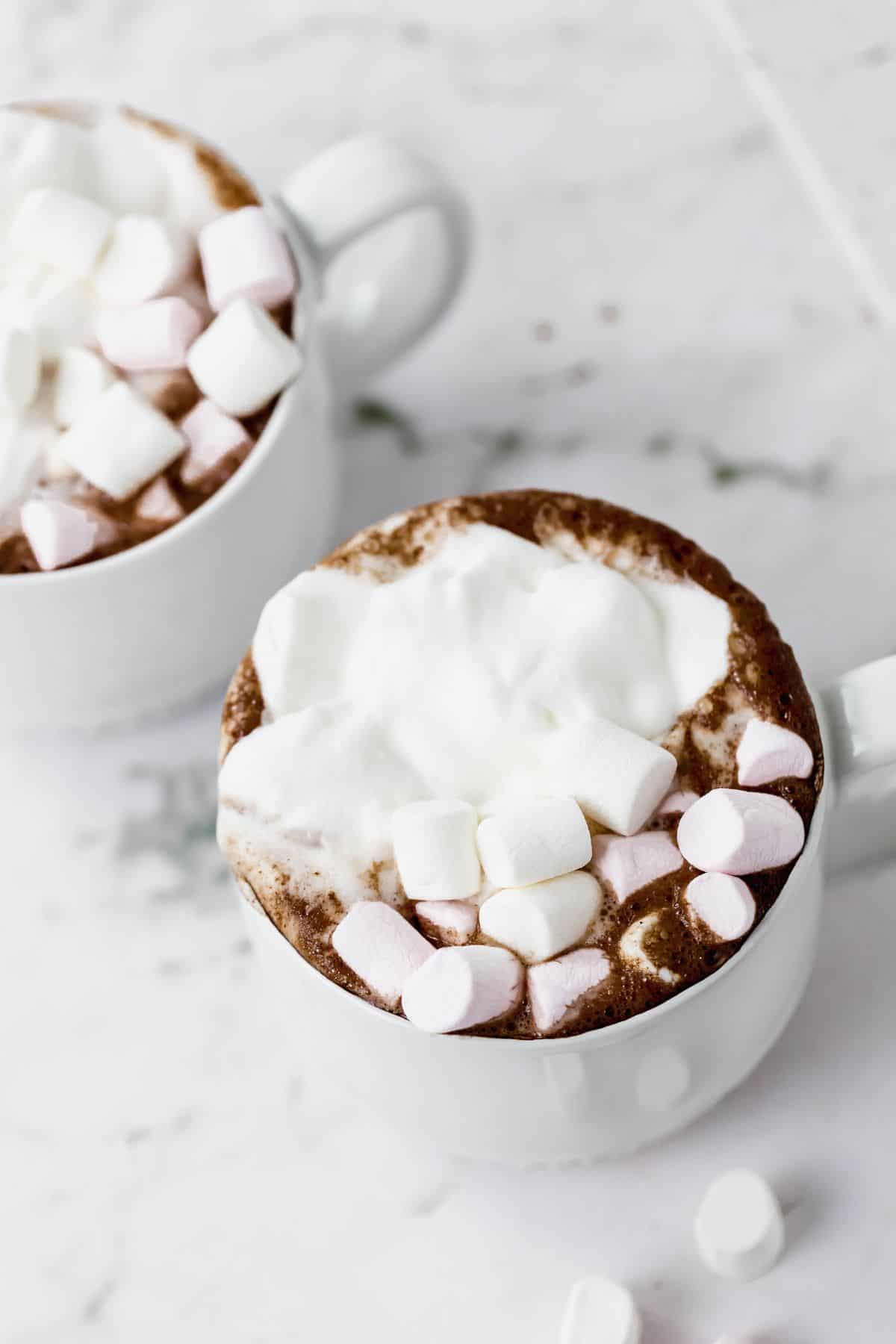 Dollop of whipped cream on top of hot chocolate.