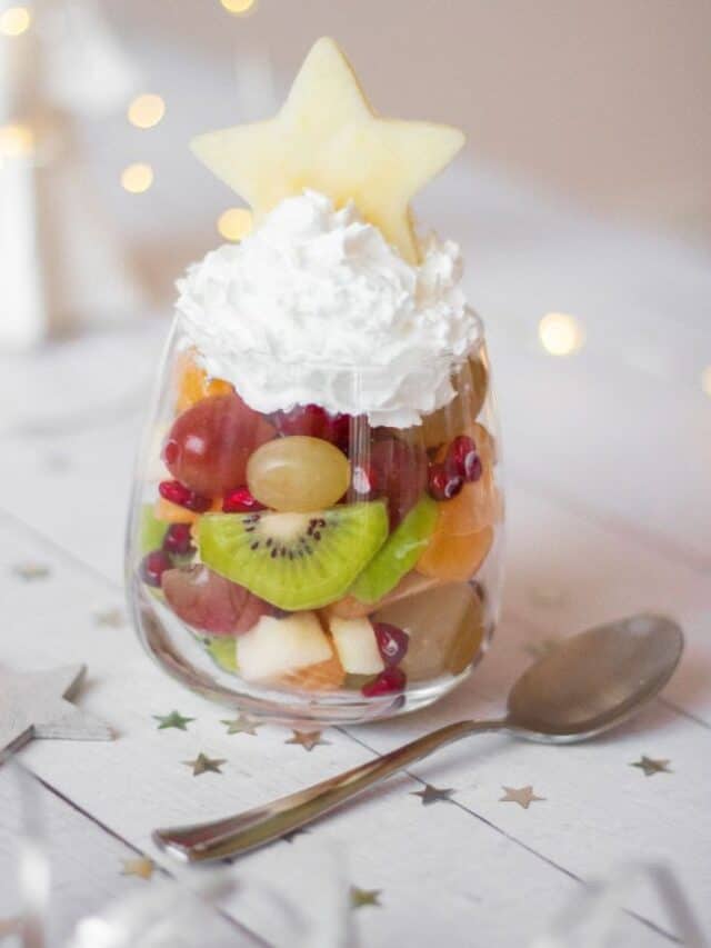 Christmas fruit cups with star and whipped cream.