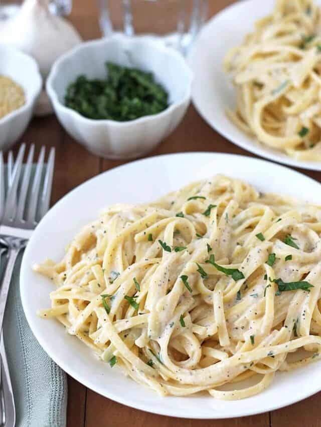 Plate of pasta with fresh parsley.