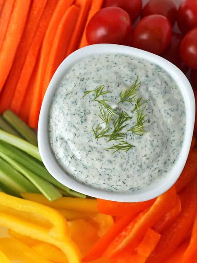 Dip in small bowl surrounded by veggie dippers.
