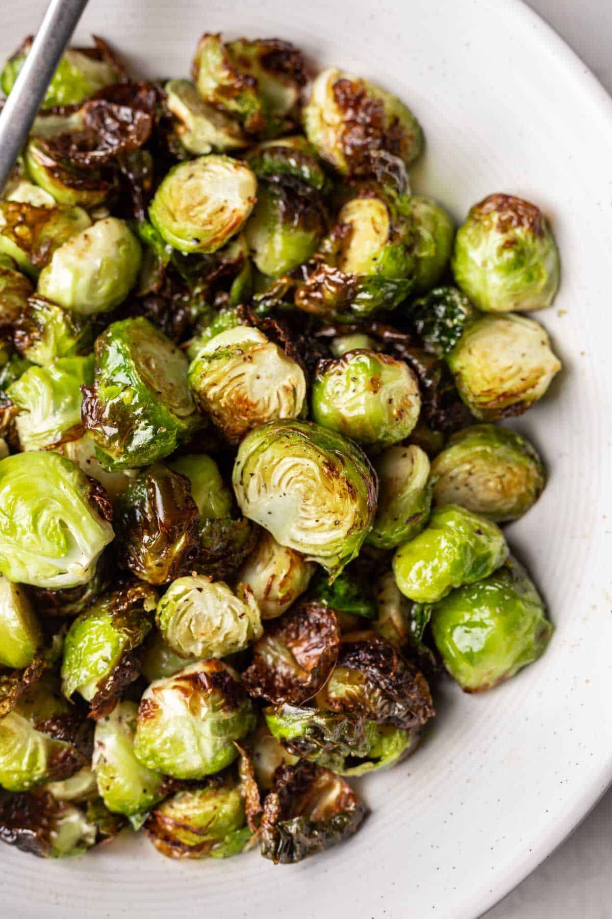 Bowl of crispy air fryer Brussels sprouts.