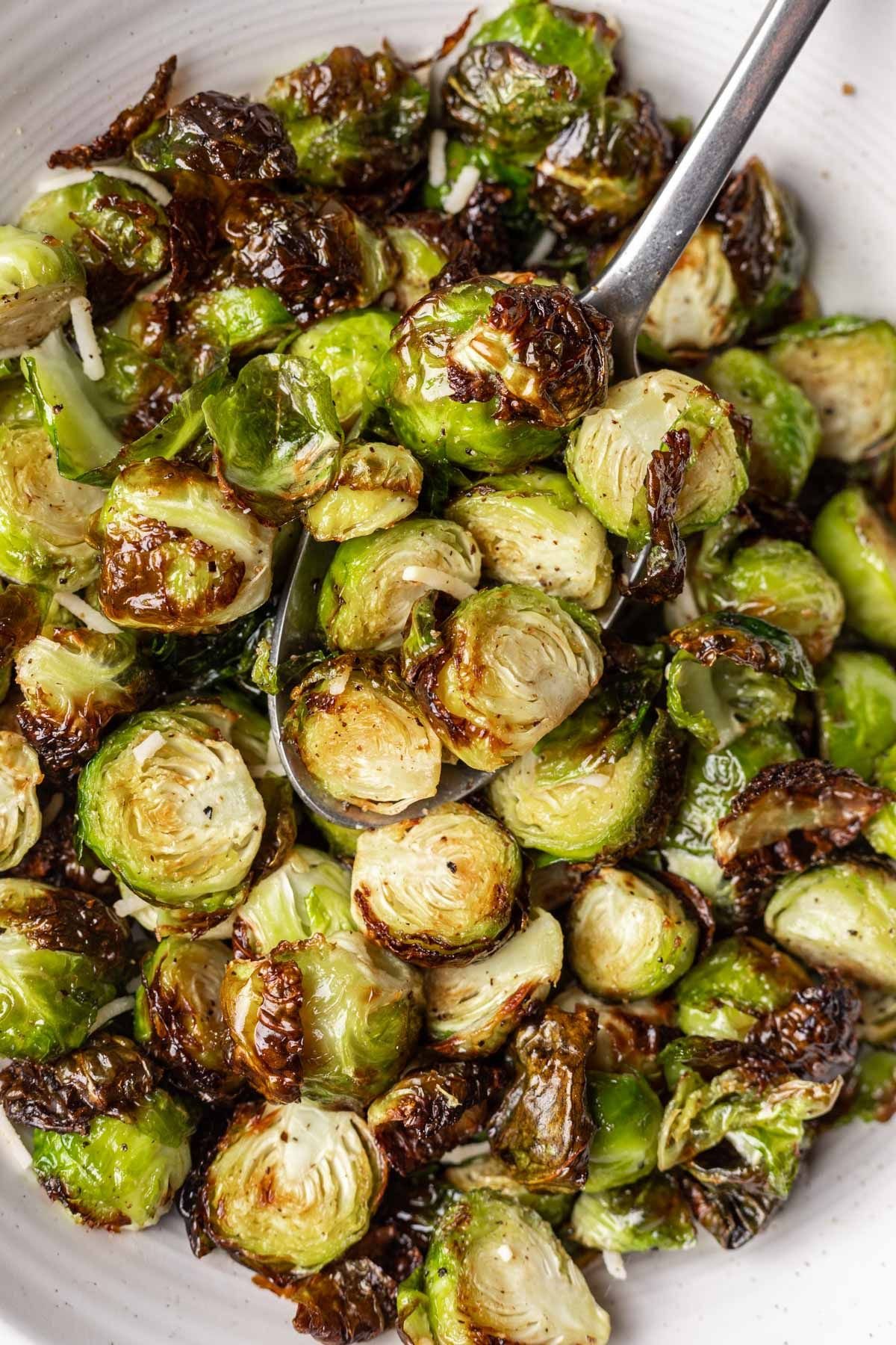 Bowl of crispy Brussels sprouts up close.
