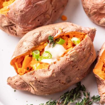 Microwaved sweet potato with herbs and butter.