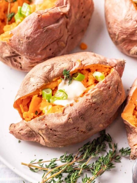 Microwaved sweet potato with herbs and butter.
