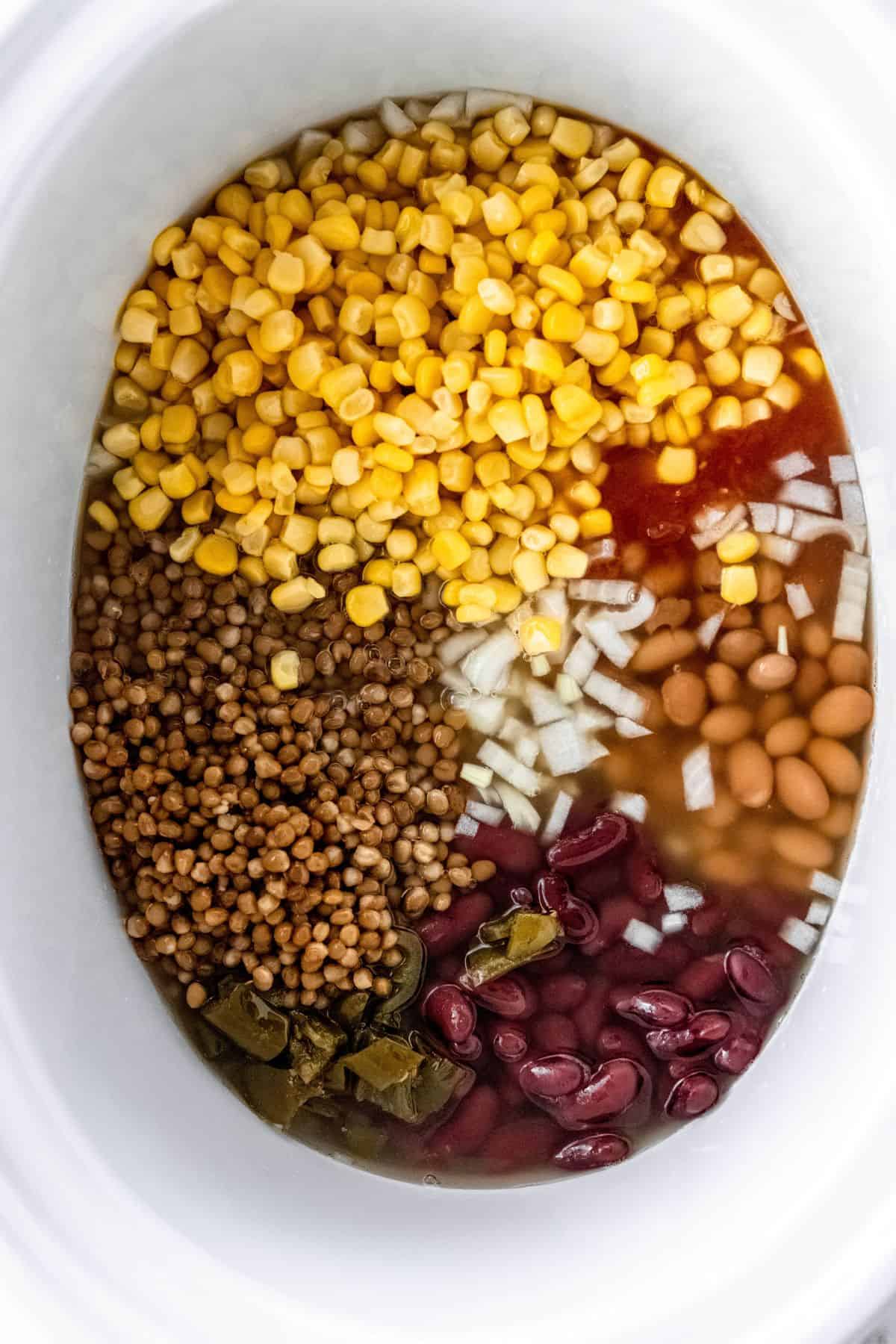 Ingredients added into slow cooker to make taco soup.
