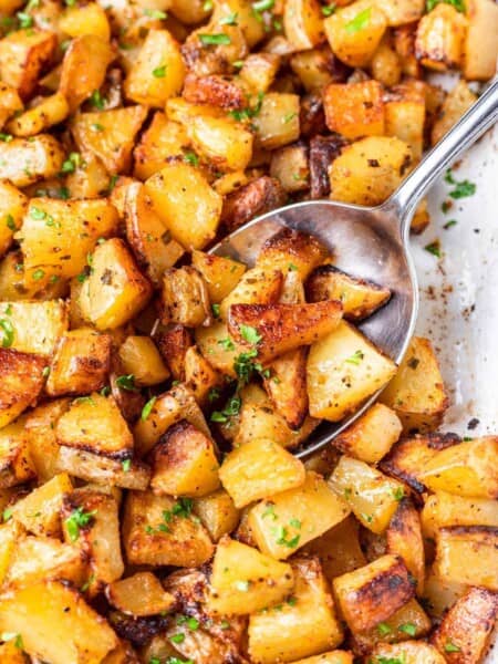 Roasted potatoes on a spoon.