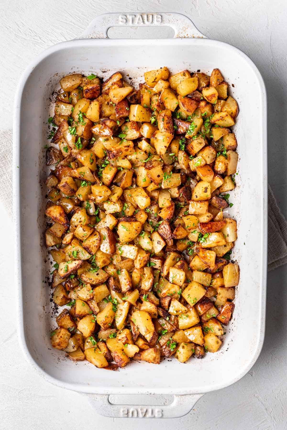 Cooked potatoes in baking dish.