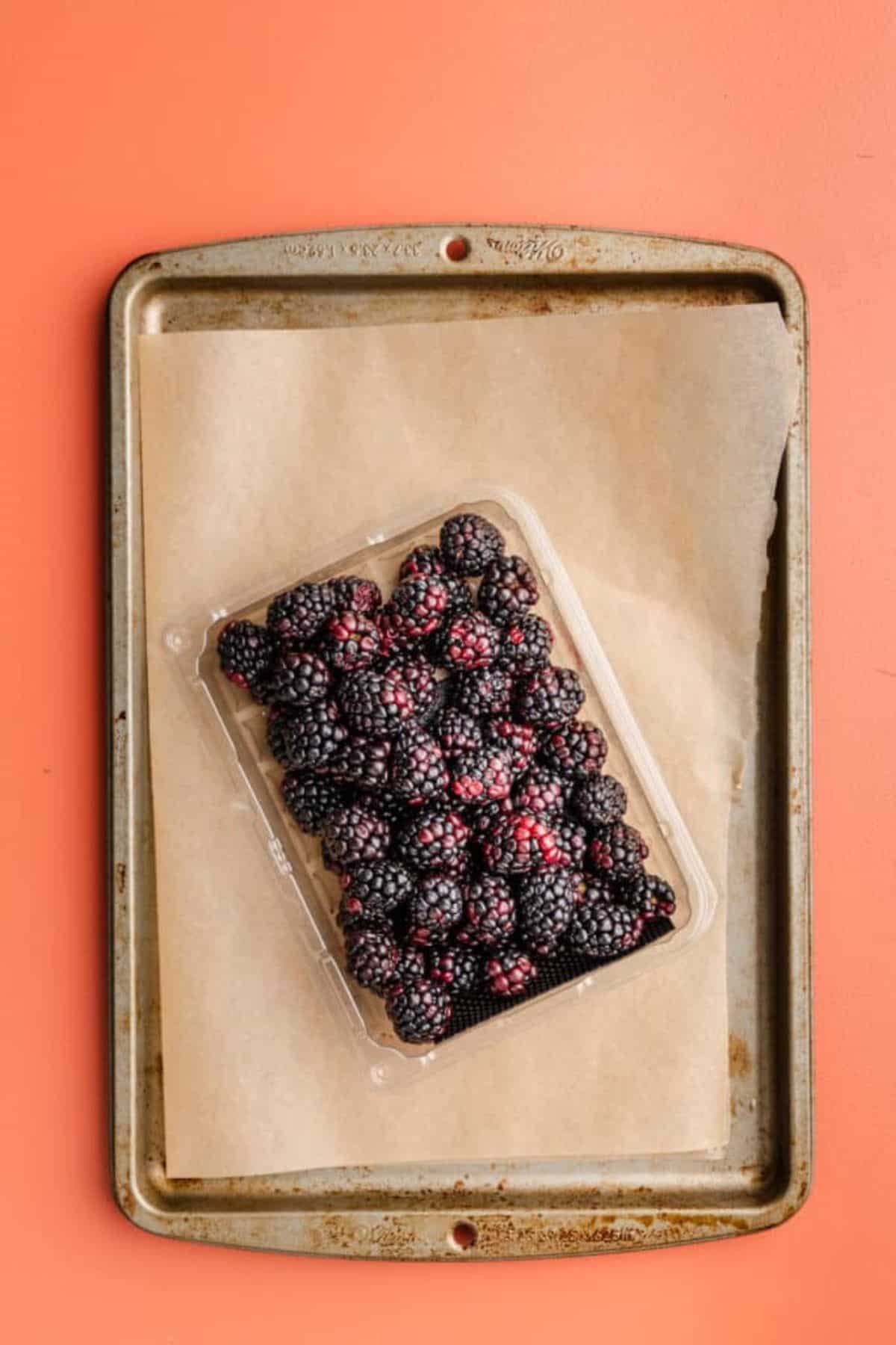 Baking sheet, parchment sheet, and berries.