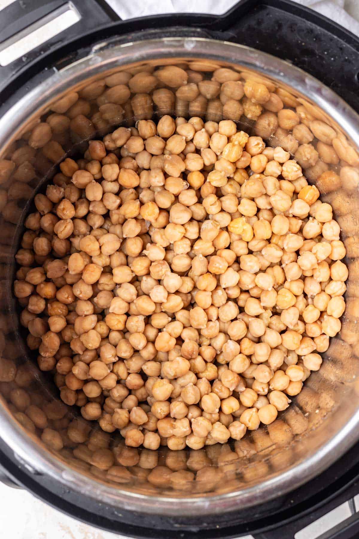 Chickpeas in the bottom of the Instant Pot after pressure cooking.