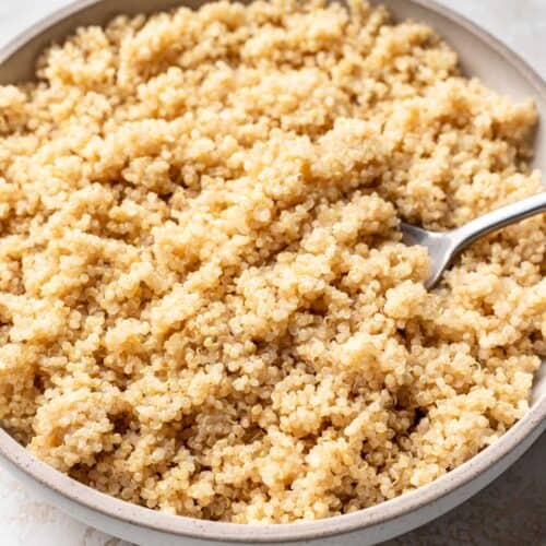 Bowl of fluffy quinoa with spoon.
