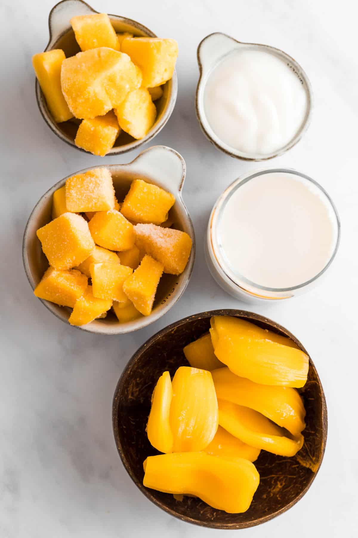 Pineapple, mango, jackfruit, yogurt, and milk.