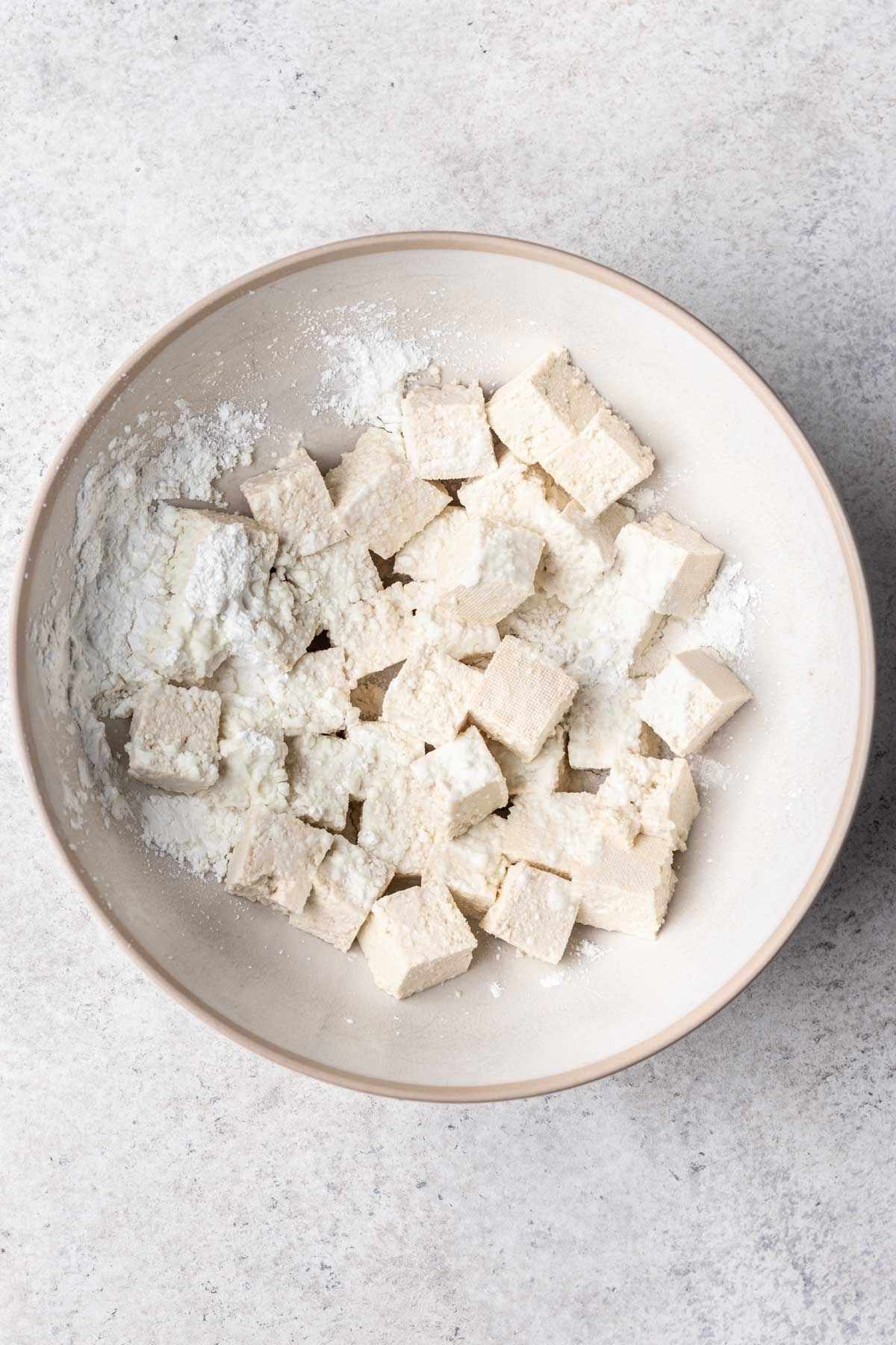 Tofu tossed in cornstarch.