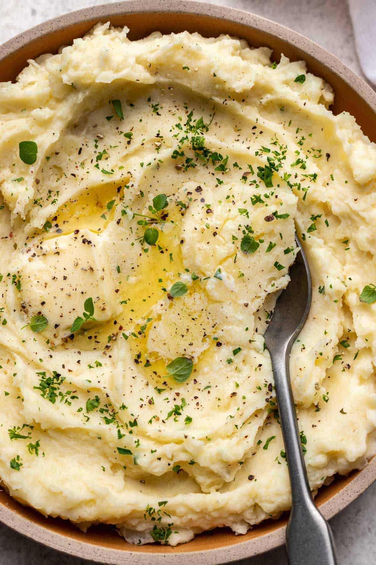 Closeup of mashed potatoes with butter.
