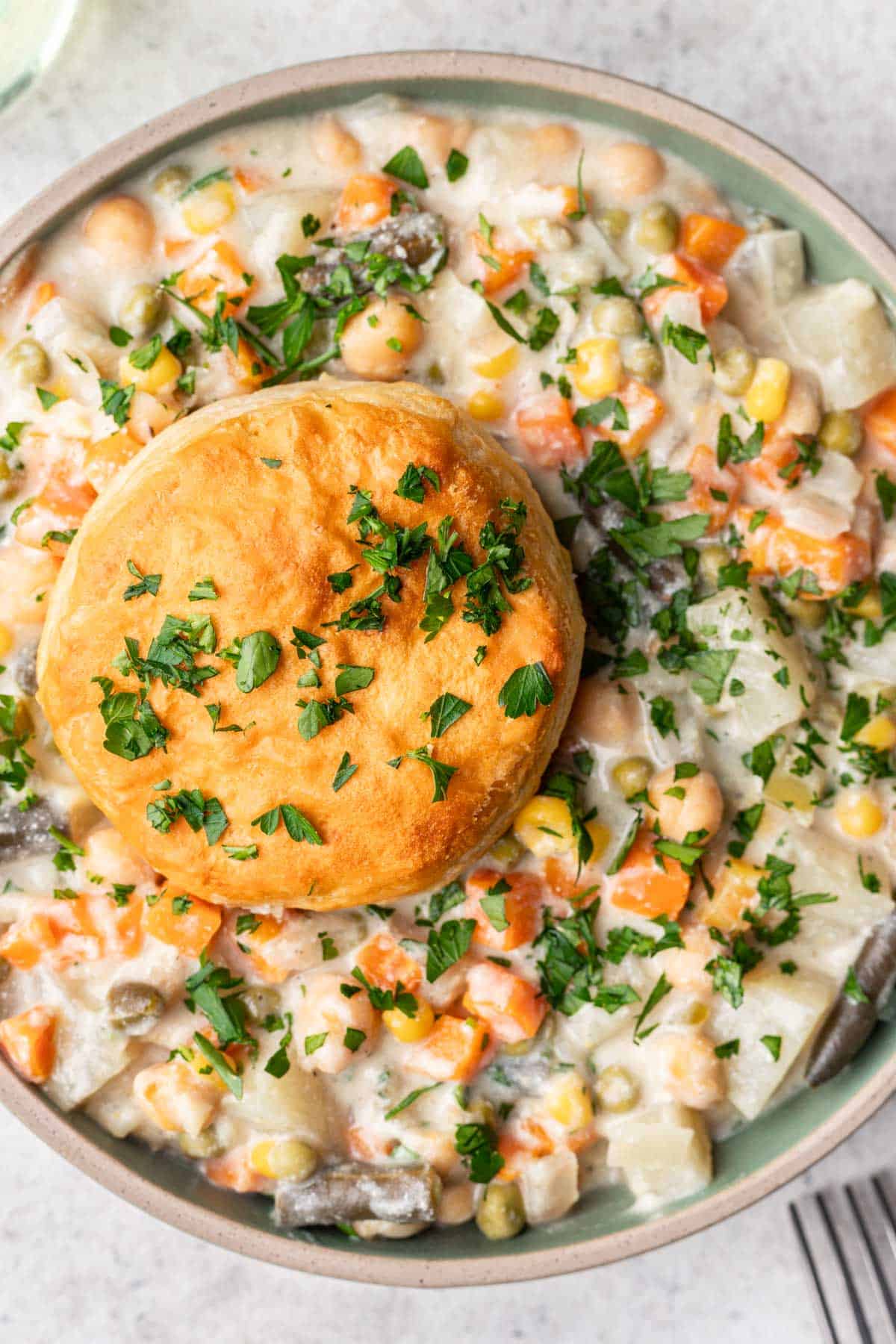 Vegan pot pie topped with biscuits.