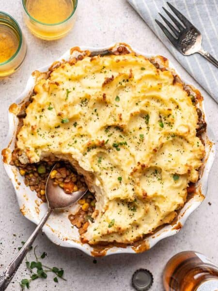 Pie dish with baked shepherd's pie and a scoop taken out for serving.
