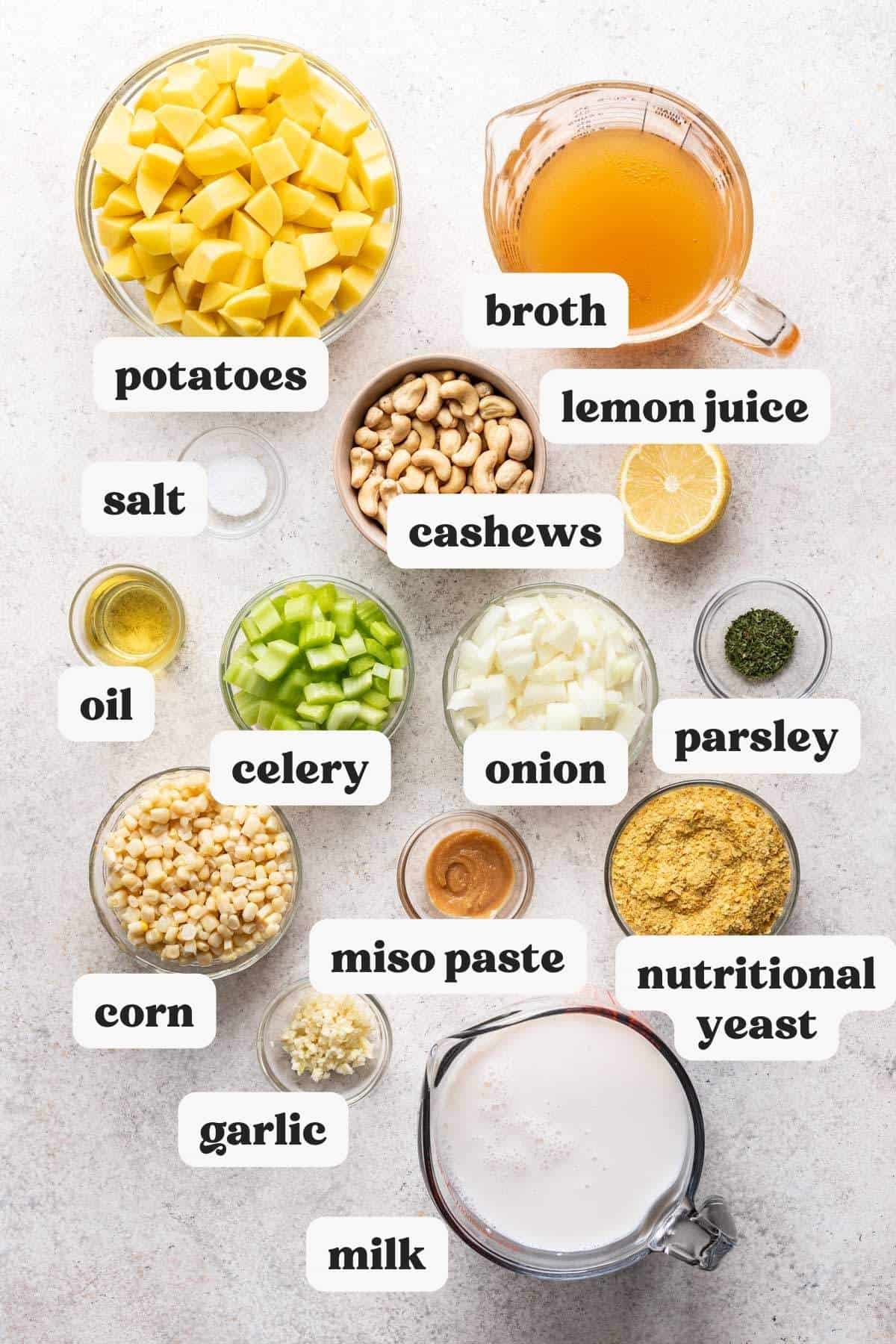 Ingredients needed to make vegan corn chowder recipe measured and labeled in individual bowls.