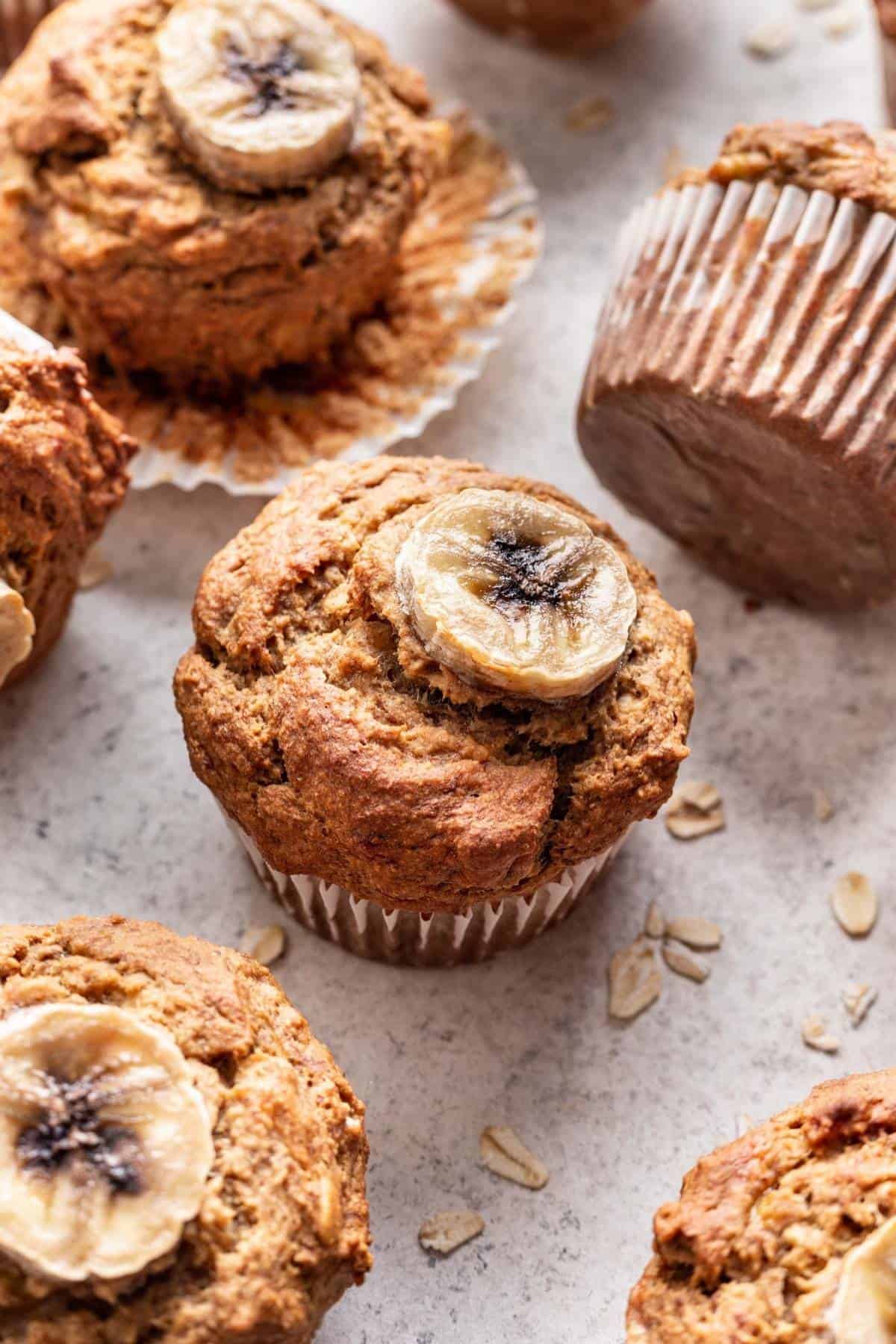 Closeup of muffin topped with thin slice of banana.